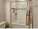 Bathroom featuring a tub shower with white tiling, mosaic accents, and storage niches at 1259 Pando Loop, Orlando, FL 32824