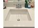 Close up of a bathroom sink with a silver faucet and white countertop at 1259 Pando Loop, Orlando, FL 32824