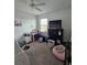 Bedroom view features a window, a desk, a dresser and a ceiling fan at 1259 Pando Loop, Orlando, FL 32824