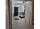 Bedroom featuring tile floors, a ceiling fan, and large window providing ample natural light at 1259 Pando Loop, Orlando, FL 32824