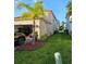 Exterior showing a well-maintained yard, two-car garage and a side yard at 1259 Pando Loop, Orlando, FL 32824