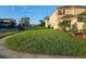 Well maintained two-story home featuring a lush green lawn and manicured landscaping at 1259 Pando Loop, Orlando, FL 32824
