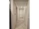 Hallway featuring tile flooring, neutral paint, recessed lighting and crown molding detail at 1259 Pando Loop, Orlando, FL 32824