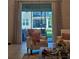 View from the living room to the screened lanai and backyard at 1259 Pando Loop, Orlando, FL 32824