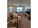 Upstairs loft with a comfortable sectional sofa, large TV, and windows for natural light at 1259 Pando Loop, Orlando, FL 32824