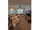 Upstairs loft area featuring comfortable seating, TV, and natural light from the windows at 1259 Pando Loop, Orlando, FL 32824