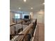 Upstairs loft with iron railing overlooking the living room, providing an open feel at 1259 Pando Loop, Orlando, FL 32824