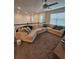 Spacious upstairs loft with modern furniture and windows, perfect for relaxing and entertaining at 1259 Pando Loop, Orlando, FL 32824