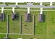 An aerial view of houses within a neighborhood showing back yards, fences, and manicured lawns at 12835 Del Lago Dr, Astatula, FL 34705