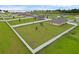 Large, grassy backyard enclosed by a white fence, featuring plenty of space for recreation and relaxation at 12835 Del Lago Dr, Astatula, FL 34705