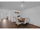 Bright dining area featuring modern decor, seating for four, and hardwood floors at 12835 Del Lago Dr, Astatula, FL 34705