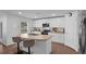 Bright kitchen with granite countertops, stainless steel appliances, and a functional kitchen island at 12835 Del Lago Dr, Astatula, FL 34705