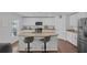 Well-lit kitchen with granite countertops, stainless steel appliances, and a functional kitchen island at 12835 Del Lago Dr, Astatula, FL 34705