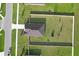 A birds eye view showing a homes fenced in back yard with trampoline and manicured lawn, with a red property outline at 12835 Del Lago Dr, Astatula, FL 34705