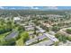 Scenic aerial view of neighborhood with lush landscape and proximity to local amenities at 1288 Americana Pl, Orlando, FL 32807