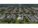 Aerial view of the neighborhood with tree lined streets and well maintained landscaping at 1288 Americana Pl, Orlando, FL 32807