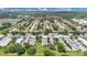 Picturesque aerial view of community with tree-lined streets and diverse housing options at 1288 Americana Pl, Orlando, FL 32807