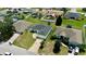 Aerial view of neighborhood featuring well-maintained homes, fenced yards, and mature trees at 130 Winsor Ave, Davenport, FL 33837