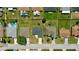 Straight-down aerial view of homes in a well-maintained neighborhood, with several featuring pools at 130 Winsor Ave, Davenport, FL 33837