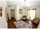 Cozy foyer with chandelier lighting and stylish decorative rug at 130 Winsor Ave, Davenport, FL 33837