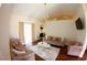 Bright living room featuring modern sofas and hardwood floors at 130 Winsor Ave, Davenport, FL 33837