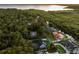 Stunning aerial perspective of homes nestled in a lush, green landscape near waterfront at 1443 Stone Trl, Enterprise, FL 32725