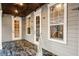 Covered back porch with decorative ceiling fans, lighting, and flooring at 1443 Stone Trl, Enterprise, FL 32725