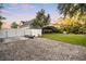A sprawling backyard featuring a kayak and storage on gravel, with a screened-in porch at 1443 Stone Trl, Enterprise, FL 32725