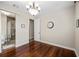 Bedroom featuring an attached bathroom with sliding glass door and hardwood floors at 1443 Stone Trl, Enterprise, FL 32725