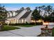 Beautiful residence featuring a well-maintained lawn, a spacious driveway, and an attached garage at 1443 Stone Trl, Enterprise, FL 32725