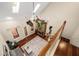 Aerial view of living room with stone fireplace, hardwood floors, staircase and sky lights at 1443 Stone Trl, Enterprise, FL 32725