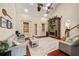 Spacious living room with vaulted ceilings, stone fireplace, hardwood floors, and access to the backyard at 1443 Stone Trl, Enterprise, FL 32725