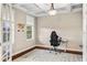 Well-lit office space featuring coffered ceilings, wood floors, and a large window for ample natural light at 1443 Stone Trl, Enterprise, FL 32725