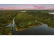 Vast waterfront landscape with lush greenery, offering scenic views at 1443 Stone Trl, Enterprise, FL 32725