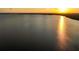 Stunning sunset reflecting on the water, creating a serene and picturesque view at 1443 Stone Trl, Enterprise, FL 32725