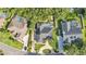 An aerial view of a private backyard oasis featuring a sparkling screened-in pool at 1455 Royal Forest Loop, Lakeland, FL 33811