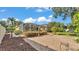 Expansive backyard featuring a screened-in pool, lush greenery, and manicured landscaping at 1455 Royal Forest Loop, Lakeland, FL 33811