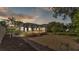 A relaxing outdoor space boasting brick patio and a screened-in lanai at 1455 Royal Forest Loop, Lakeland, FL 33811