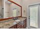 Bathroom features granite counters, dual sinks, and a patio door at 1455 Royal Forest Loop, Lakeland, FL 33811