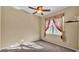 Bedroom with neutral carpet, a ceiling fan, and one window allowing plenty of natural light at 1455 Royal Forest Loop, Lakeland, FL 33811