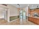 Cozy dining area with sliding doors that lead to the outdoor pool area and kitchen at 1455 Royal Forest Loop, Lakeland, FL 33811