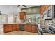 Kitchen featuring granite countertops, custom cabinets, and modern appliances at 1455 Royal Forest Loop, Lakeland, FL 33811