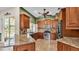 Well-lit kitchen featuring granite countertops, stainless steel appliances, and wood cabinets at 1455 Royal Forest Loop, Lakeland, FL 33811