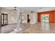 Open living room with tile floors and large windows, offering a great view at 1455 Royal Forest Loop, Lakeland, FL 33811