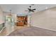 Open-concept living room with access to the kitchen and sliding doors to the pool at 1455 Royal Forest Loop, Lakeland, FL 33811