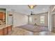 Open-concept floor plan connecting the living room to the kitchen and other living spaces at 1455 Royal Forest Loop, Lakeland, FL 33811