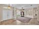 Spacious living room features tile flooring, large windows, and a ceiling fan at 1455 Royal Forest Loop, Lakeland, FL 33811