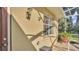 Outdoor shower area with privacy wall, tile flooring, and nearby door entrance at 1455 Royal Forest Loop, Lakeland, FL 33811