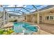 Inviting screened-in pool with a spacious deck, perfect for relaxation and outdoor entertaining at 1455 Royal Forest Loop, Lakeland, FL 33811