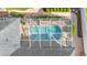 Bird's eye view of screened pool, surrounded by brick patio, greenery, and partial house view at 1455 Royal Forest Loop, Lakeland, FL 33811